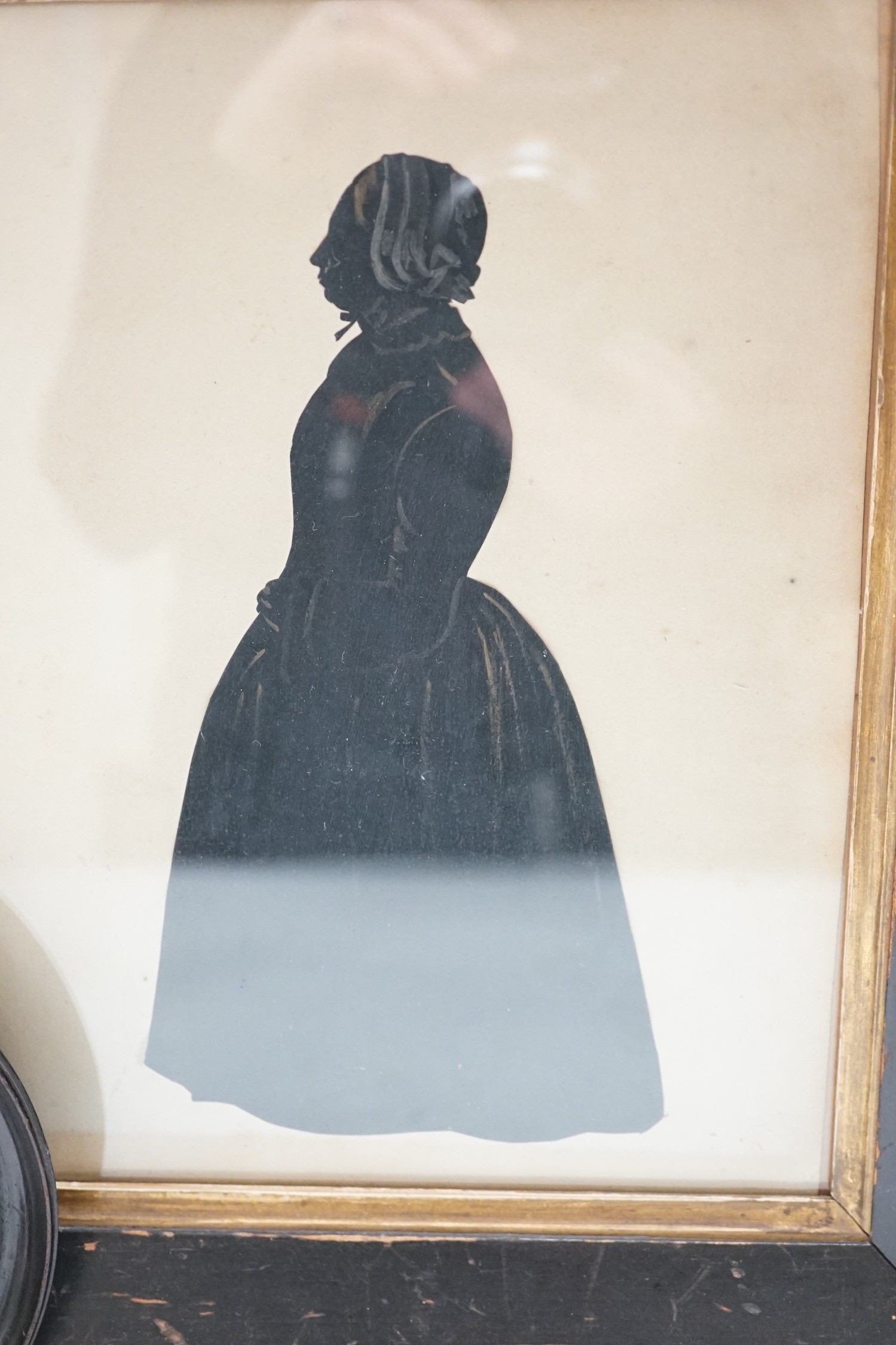 An oval silhouette dated on reverse 1777 together with a larger later silhouette-25cms high x 19cms wide